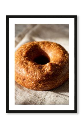 Rustic Baked Donut or Bagel with Highly Textured Surface and Natural Sunlight