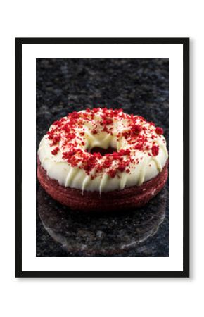 Luxurious Red Velvet Donut with White Cream Cheese Frosting on Black Granite