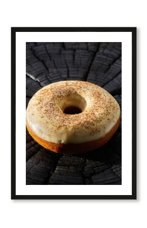 Vibrant Green Glazed Donut on Black Textured Surface with Shadow