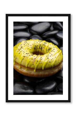 Lemon Poppy Seed Glazed Donut on Textured Black River Pebbles