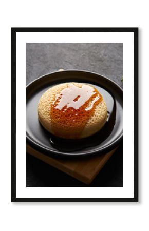 Crème Brûlée Donut or Soufflé Pancake with Caramel and Rosemary Garnish