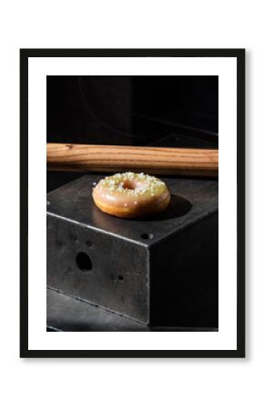 Minimalist Small Donut on Black Industrial Metal Block with Wood Accent
