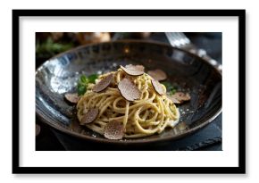 Luxurious close-up of spaghetti pasta with creamy sauce and black truffle shavings