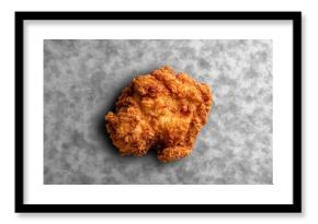 Crispy fried chicken breast on grey background