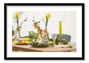 Table setting with spring flowers in light room
