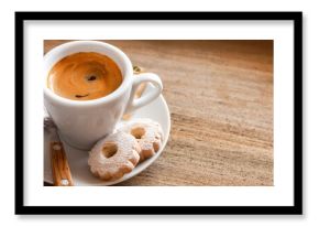 Italian breakfast with espresso coffee and canestrelli biscuits on wooden table