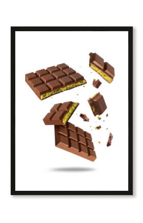 Broken Dubai chocolate in the air isolated on a white background. Dubai chocolate is made with pistachio paste and kadayif