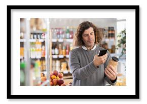 European scans the barcode on a can of beans, reads the composition of the product, calorie content and expiration date