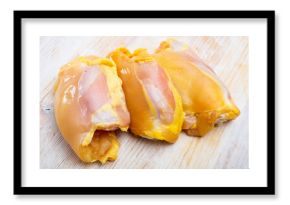 Food background of raw chicken breast fillet at light wooden table