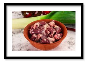 Raw chicken hearts in the bowl