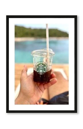 CONDADO, PUERTO RICO - JANUARY 24, 2017: A Starbucks coffee on the beach in Condado, Puerto Rico.