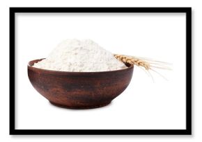 Wheat flour in bowl and spike on white background