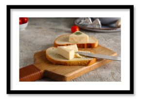 Wooden board of bread slices with triangles of tasty processed cheese and tomatoes on grey background