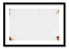 Sweet and salty snacks double border over a white marble banner background. Chocolate, popcorn, pretzels, nuts and cookies. Top view.