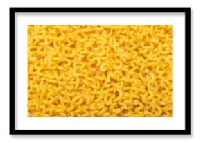 Raw yellow cavatappi pasta texture background top view. Pile of dry uncooked noodles pattern