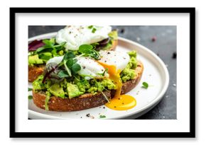 Avocado toast with poached eggs and fresh microgreens. Tasty snack. Delicious food for breakfast.