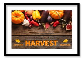 Different fresh vegetables and fruits on wooden background. Harvest festival