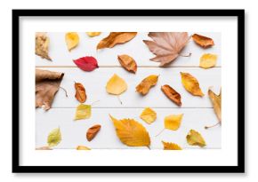 Autumn composition. Pattern made of dried leaves and other design accessories on table. Flat lay, top view