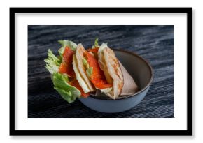 Homemade salmon flatbread on a table in a cafe. 