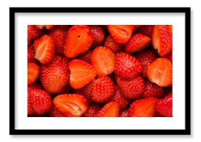 Red bright cut strawberries background. Fresh berries. Closeup. Top down view.