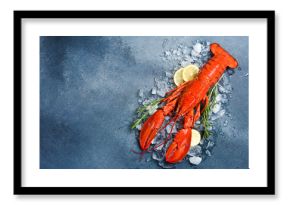 Delicious boiled lobster with ice cubes and lemon. On a stone background. Top view, free space for text. Fresh seafood.