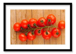 Bunch of red tomatoes are on a wooden table
