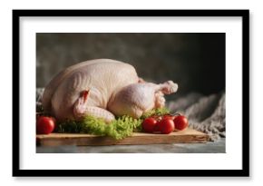 The Chicken on a Rustic Cutting Board with Tomatoes and Lettuce