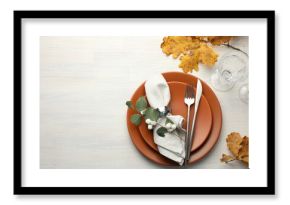 Beautiful table setting with autumn decor on white wooden background, flat lay. Space for text