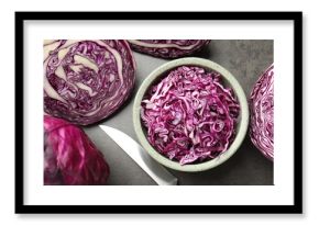 Fresh red cabbages and knife on grey table, flat lay