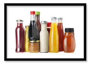 Bottles and jars with different tasty sauces isolated on white