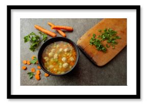 Classic meatball soup with potatoes,  carrot and greens.