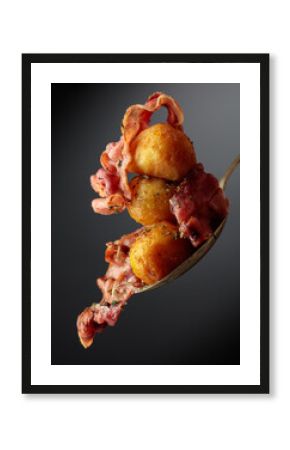 Roasted potatoes with bacon sprinkled with spices.