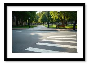 Pedestrian zebra crossing on asphalt road with green park area and trees. Crosswalk marking signals safe street passage for walkers and bikes. Urban quiet street.