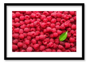 Fresh ripe raspberries and leaf as background, top view