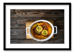 Baked salmon fillet on wooden table. Top view