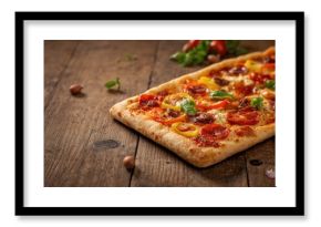 Homemade mini hamburgers with black buns, emphasizing food preparation and presentation