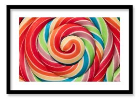 Colorful rainbow lollipop swirl on wooden stick as food color background