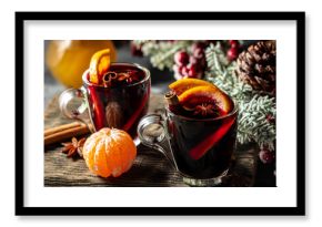 Christmas mulled wine with spices and oranges, festive cocktail