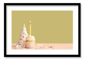 Sweet Birthday cupcake with burning candle and party hat on colorful background