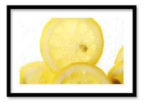 Soda water with lemon slices as background, closeup