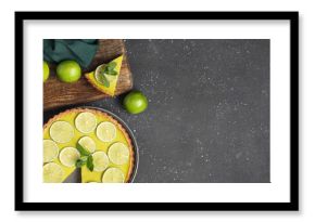 Plate and wooden board with tasty lime tart on black background