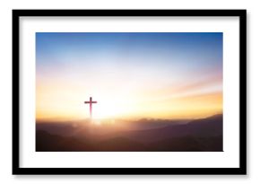 Silhouette of crucifix cross on mountain at sunset sky background.
