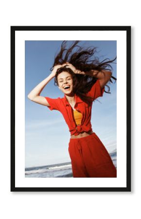 Smiling Woman Dancing with Joy on a Sunny Beach, Embracing Freedom and Enjoying Fun Summer Vacation