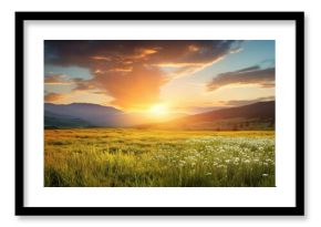 The sun is setting, casting a warm afterglow over the grassy field with mountains in the background. Cumulus clouds dot the sky, creating a picturesque natural landscape