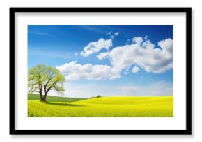 Solitary Tree Standing Tall in a Meadow of Golden Blooms Under a Clear Blue Sky