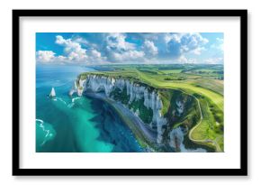 A panoramic view of the lush green golf course nestled on white cliffs overlooking blue sea, with the iconic tall rock arches