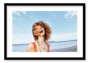 Joyful Wanderlust: Smiling Woman Backpacker Embracing Freedom on Beach