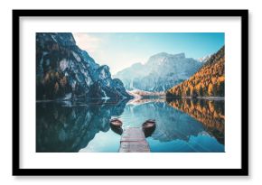 Boats on the Braies Lake ( Pragser Wildsee ) in Dolomites mountains, Sudtirol, Italy