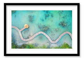 Aerial landscape from the drone - blue water and wooden bridge