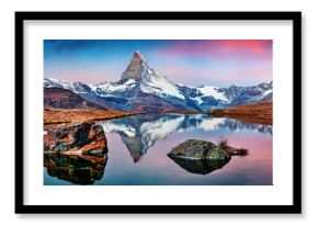 Panoramic morning view of Stellisee lake with Matterhorn / Cervino peak on background. Impressive autumn scene of Swiss Alps, Zermatt resort location, Switzerland, Europe. 